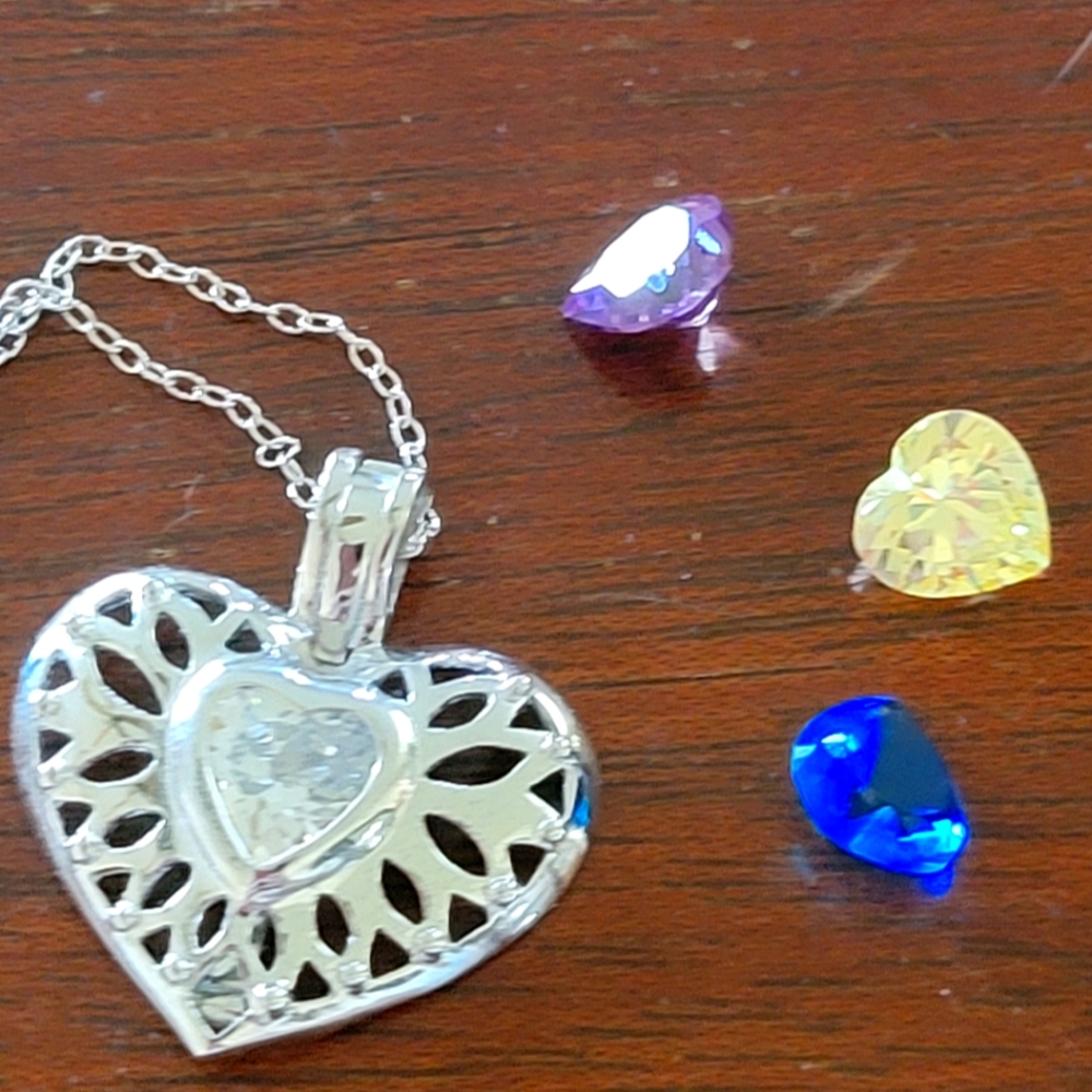 Changeable heart pendant necklace, silver tone. Good condition